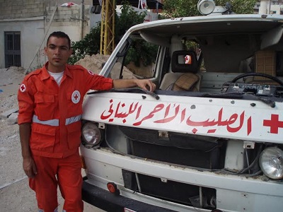 Lebanese Red Crescent workers and their ambulances attacked by the IDF, July 2006. (Photo: Dahr Jamail)