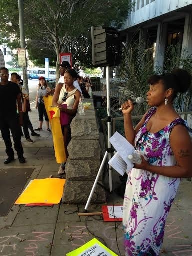 Keyanna Celina and community members rally in front of LA District Attorney Jackie Lacey's office on Thursday, August 21, demanding criminal charges for LAPD officers that killed unarmed Ezell Ford and Omar Abrego. (Photo: Bethania Palma Markus)