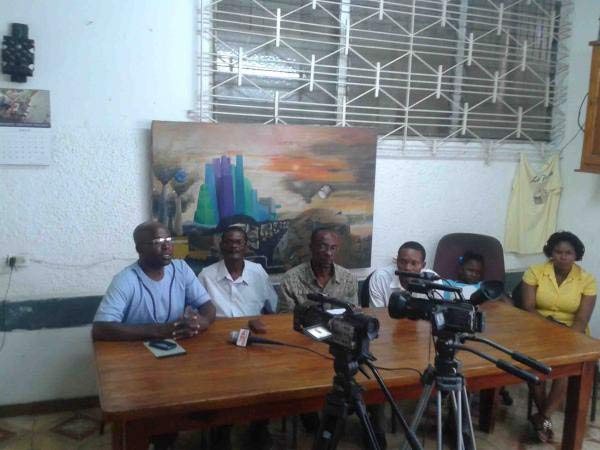Representatives from the Collective, and KOPI (of Île-à-Vache), and family members of imprisoned Lamy speak to the press on August 25, 2014.