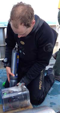 Graduate student Ben Turschak transfers water samples. (Photo: Brian Bienkowski)