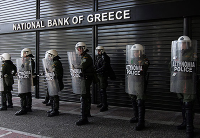 Greece, 2010: Tens of thousands of striking Greek workers took to the streets, some throwing stones at police, in a defiant show of protest against austerity measures aimed at averting the debt-plagued country’s economic collapse. (Photo: underclassrising.net)