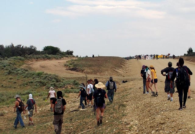 Land defenders block the road leading to a tar sands mine site. The protest prevented the company U.S. Oil Sands from clearing vegetation on land where it plans to dig open pit mines and tailings ponds for toxic waste.