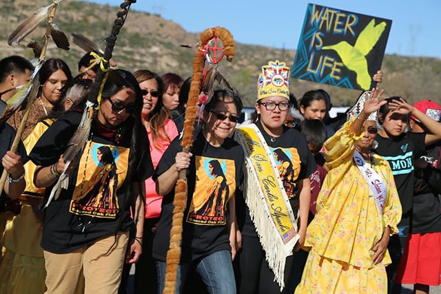 Women from the tribe lead the march into Oak Flat. (Photo: Roger Hills)