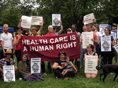 Members of the Southern Maine Workers Center and the Maine Health Care is A Human Right campaign rally in solidarity with the the Moral Mondays Movement in North Carolina. (Photo: Roger Marchand)