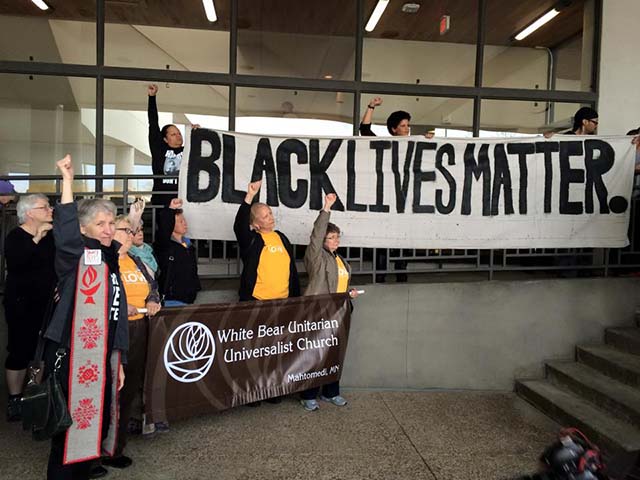 Members of White Bear UU Church of Mahtomedi, MN, stand in solidarity with BLM at same action. (Photo: Ashley Horan)