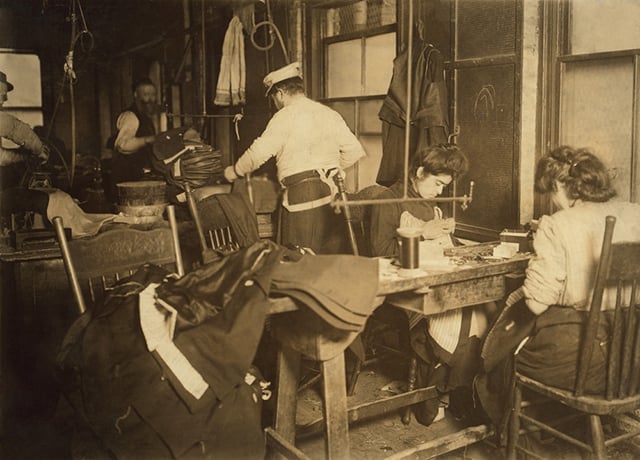 Workers assemble wares in a cramped New York City garment sweatshop in 1908. The labor protections that ultimately abolished such work enviornments were indirectly criticized by former Florida governor Jeb Bush in some of his 2016 campaign statements. (Photo via Shutterstock)