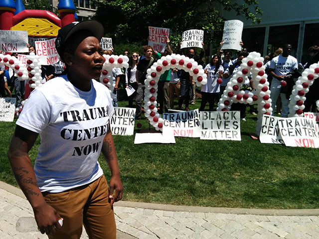 Activists from the Trauma Care Coalition disrupt the University of Chicago’s Alumni Weekend in June 2015. (Photo: Kelly Hayes)