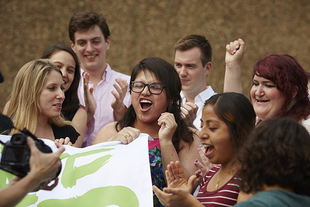 Participants cheer for the cameras at the end of a successful production day. (Photo: All* Above All)