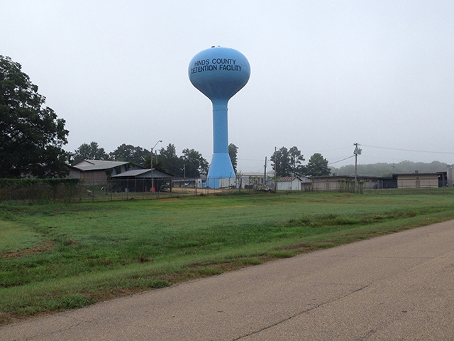 A watertower marks the entry to the holding facility near Raymond Penal Farm where Akinola Gonzalez was detained. (Photo: Dara Cooper)