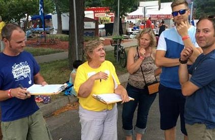 Elaine Grace Dwiter Branjord collects signatures for Colorado Care at NewWestFest. (Photo: ColoradoCareYES)