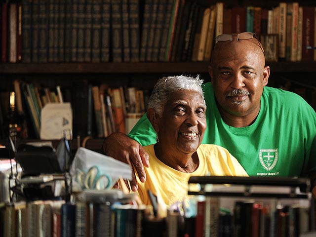 Pastor Ron Smith with his mother Ann Smith, retired teacher and community leader, in Ann's office at her home near Tallassee, AL. (Photo: Jeronimo Nisa for Earthjustice)