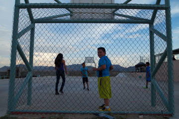 Children of Sofia Aleman and Guadalupe Rodriguez play soccer on a court close to the Universidad Tecnológica Paso del Norte, which is seen as a funnel for Anapra youth to enter the maquilas. (Photo: John Washington)