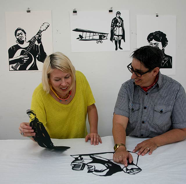 Kate Schatz (L), author of Rad American Women A-Z, discusses artwork with the book's illustrator Miriam Klein Stahl (R). (Photo: City Lights Books)