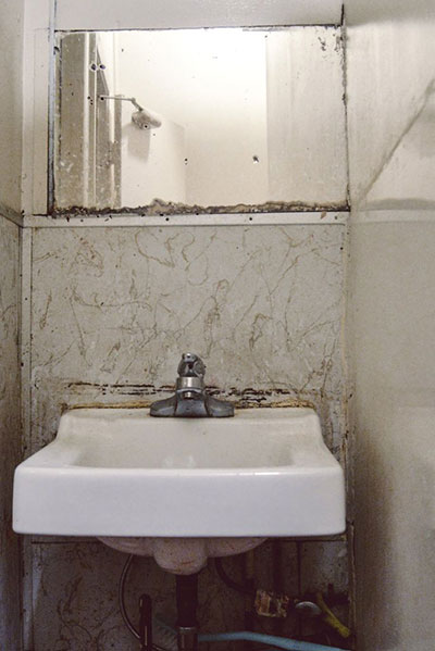 The restroom on Ivy Gao's floor includes a sink that multiple residents must share in her Chinatown single-room occupancy hotel. (Photo: Tudor Stanley)