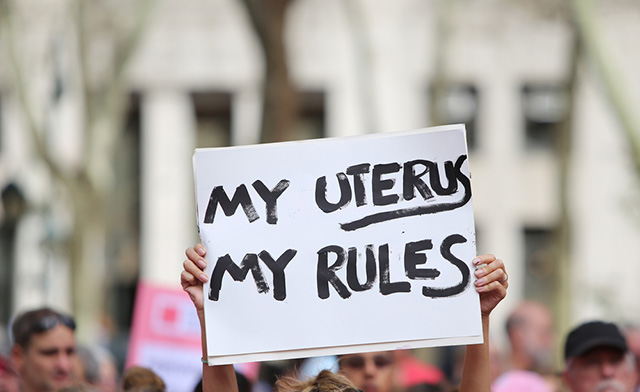 A demonstrator displays a sign at a rally in New York City on September 29, 2015. Planned Parenthood has been fielded legislative attacks sparked by misleading documentaries by the Center for Medical Progress that falsely claimed that the medical provider sold the body parts of embryos for profit. (Photo via Shutterstock)