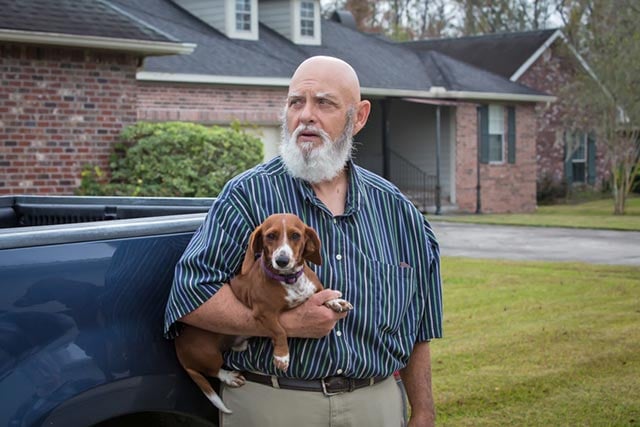 Tim Brown on Sportsman Drive with one of his dogs. (Photo: ©2015 Julie Dermansky)