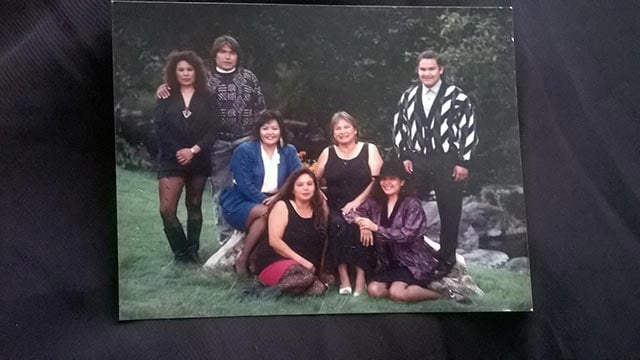 The Jack siblings and their mother. From left to right: standing: Lila, Leon, Leah (in chair), Mary (in chair, mother), Lonnie; sitting on grass: JoAnna, Lana. (Photo: Courtesy of Lana Jack)