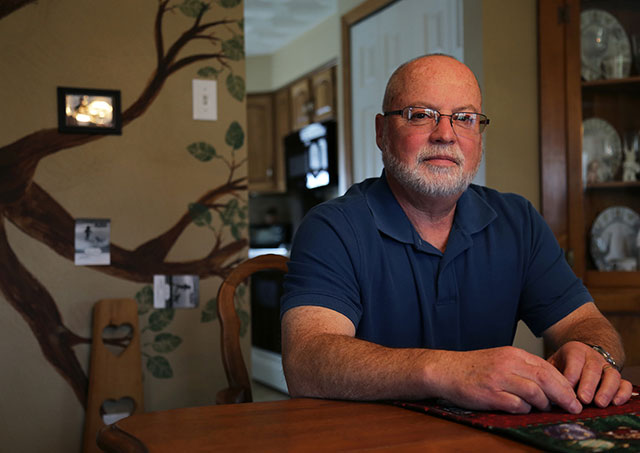 Gary Schuette, pictured at his Penn Township home on Greer Lane, said he and most of his neighbors leased their gas rights to a drilling company last year. (Photo by Natasha Khan / PublicSource)