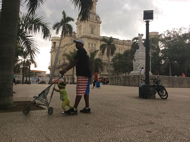 Father and daughter in Havana's Parque Central on the first day of President Obama's visit. (Photo: Patrick Sheehan)