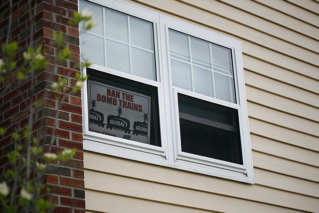 A sign in one of the windows at Ezra Prentice Homes. (Photo: Earthjustice)