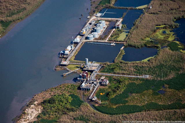 A natural gas flare is visible at an oil and gas facility in Plaquemines Parish. (Photo: Julie Dermansky)