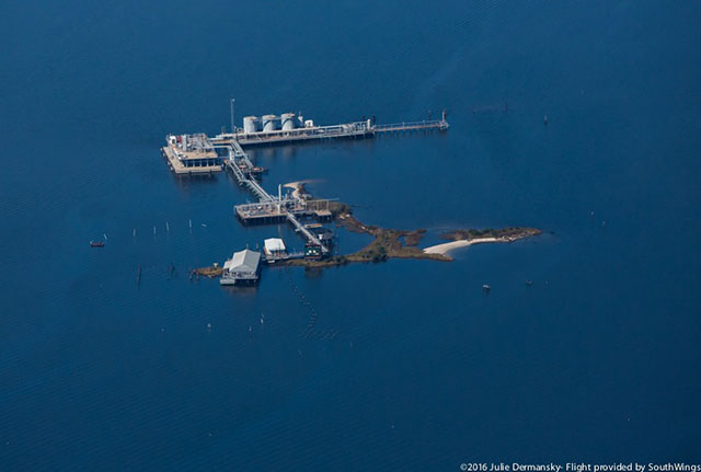 The oil and gas industry has long been building on the coastal land of Plaquemines Parish, though that activity has contributed to the disappearance of that fragile land due to coastal erosion. (Photo: Julie Dermansky)