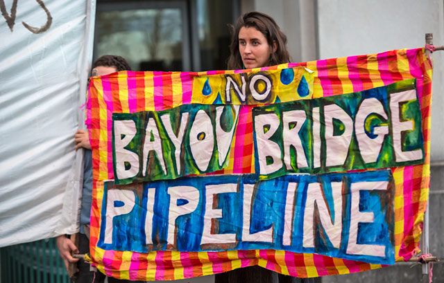 Opponents of the Bayou Bridge pipeline held a rally before an Army Corps of Engineers and Louisiana Department of Environmental Quality hearing on whether to grant permits allowing the pipeline to cross the Atchafalaya Basin. (Photo: Julie Dermansky)
