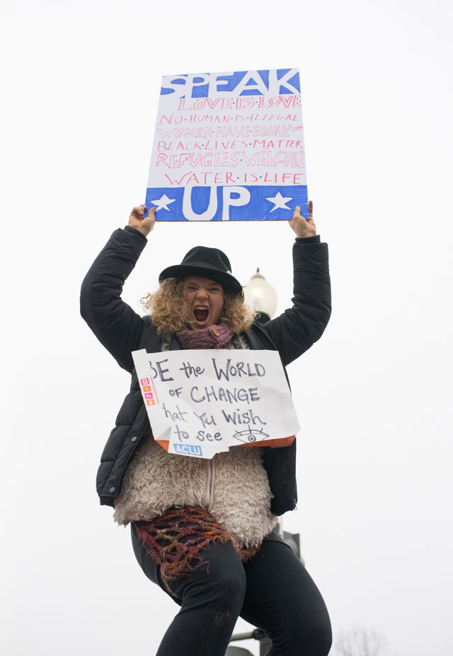 Women's Marchers took to every open space, holding signs and chanting - even the Capitol's sign posts and electric boxes were taken up. (Photo: Zach Roberts)