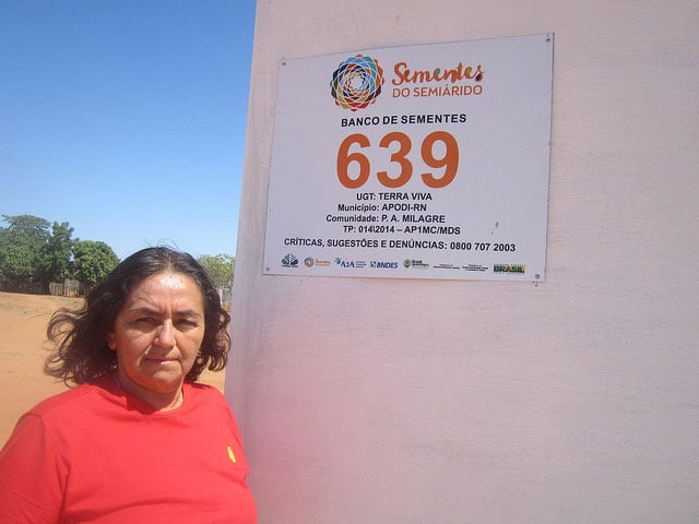 Antonia de Souza Oliveira in front of the seed bank in Milagre, a rural settlement of 28 families in the state of Rio Grande do Norte in Brazil, which has become famous for the strong participation of women in the village’s collective activities. (Credit: Mario Osava / IPS)