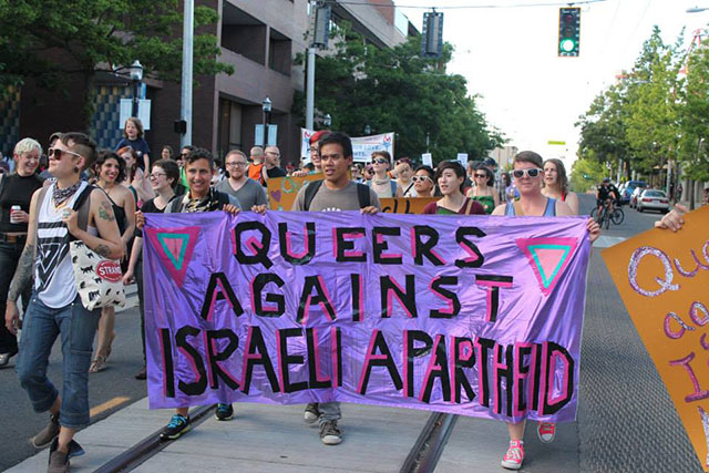 Queers Against Israeli Apartheid demonstrate at Seattle Pride in 2013. (Credit: Queers Against Israeli Apartheid, Seattle)