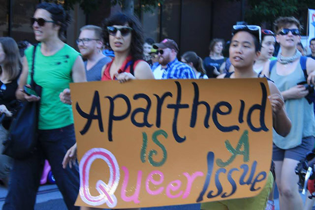 Queers Against Israeli Apartheid march at Seattle Pride in 2013. (Credit: Queers Against Israeli Apartheid, Seattle)