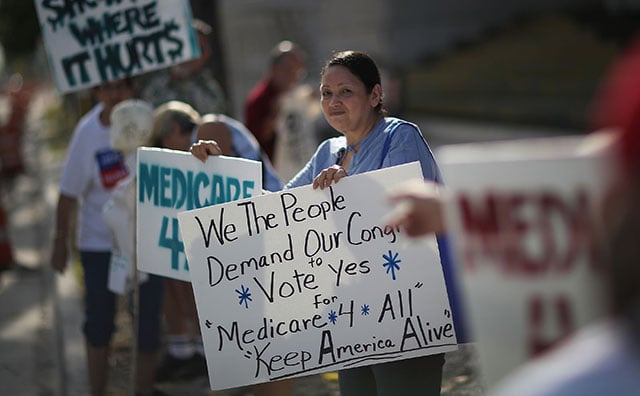 Carmen C. joins with other protesters against Republican senators who have not spoken up against Affordable Care Act repeal and demand universal, affordable, quality healthcare for all on July 24, 2017 in Fort Lauderdale, United States. (Photo: Joe Raedle / Getty Images)