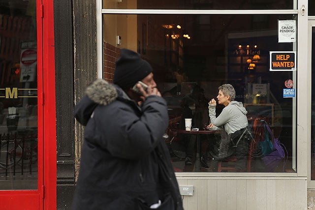 People sit in a cafe in a Fort Greene neighborhood on February 27, 2014 in the Brooklyn borough of New York City. Numerous Brooklyn neighborhoods, which were once considered dangerous and underdeveloped, have gone through transformations in recent years resulting in more affluent newcomers displacing long time residents. (Photo: Spencer Platt / Getty Images)