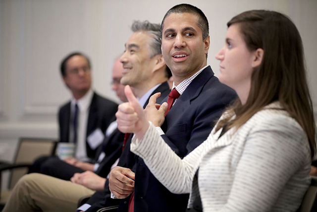 Federal Communication Commission Chairman Ajit Pai (2nd right) prepares to deliver remarks and participate in a discussion at The American Enterprise Institute for Public Policy Research May 5, 2017 in Washington, DC. (Photo: Chip Somodevilla / Getty Images)