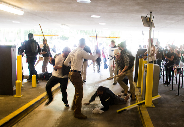 White supremacists beat Black schoolteacher Deandre Harris in a parking garage in Charlottesville on August 12, 2017. (Photo: Zach D. Roberts)