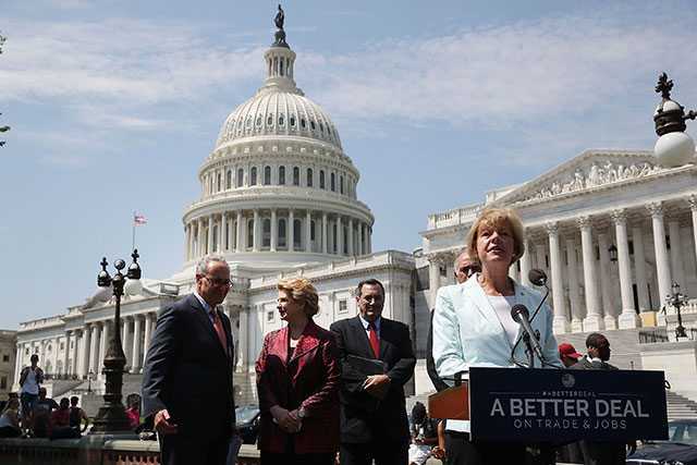 Sen. Tammy Baldwin (D-WI) speaks alongside fellow Democrats, (L-R) Senate Minority Leader Charles Schumer (D-NY), Sen. Debbie Stabenow (D-MI) and Sen. Joe Donnelly (D-IN) during an event to unveil 'A Better Deal On Trade and Jobs', in front of the US Capitol on August 2, 2017 in Washington, DC. (Photo: Mark Wilson / Getty Images)