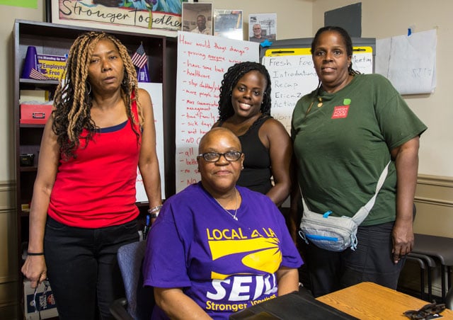 Cafeteria workers in New Orleans are working to organize a union in order to negotiate for better wages and working conditions with Volunteers of America, a wealthy Christian ministry contracting with local elementary schools to provide meals to students. From left to right: Damita Hall, Pamela Bourgois, Quintessa Dampeer and Debra Slaughter. (Photo: Julie Dermansky)