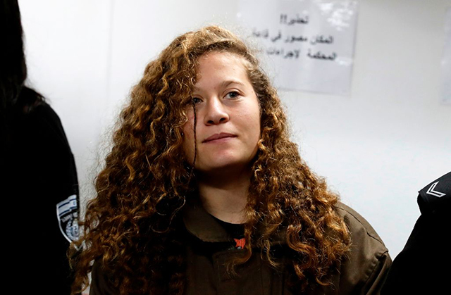 Sixteen-year-old Ahed Tamimi stands for a hearing in the military court at Ofer military prison in the West Bank village of Betunia on January 1, 2018. Israeli authorities are seeking 12 charges against Ahed after a video of her slapping and kicking two Israeli soldiers in the West Bank went viral, her lawyer said. (Photo: Ahmad Gharabli / AFP / Getty Images)