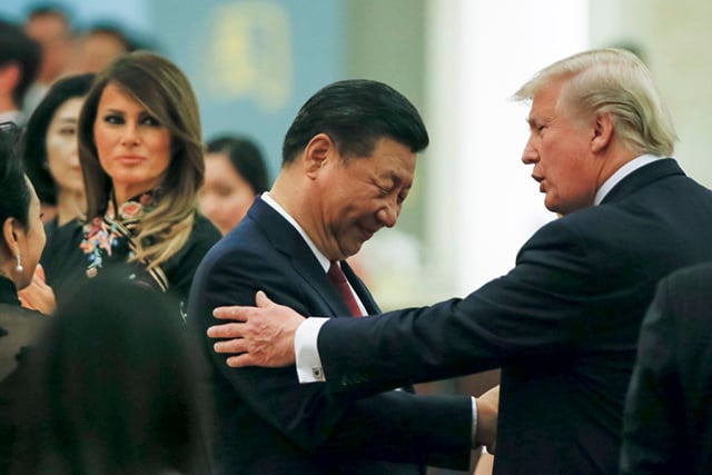 China's President Xi Jinping and China's first lady Peng Liyuan and U.S. President Donald Trump and first lady Melania attend a state dinner at the Great Hall of the People on November 9, 2017, in Beijing, China. (Photo: Thomas Peter - Pool / Getty Images)