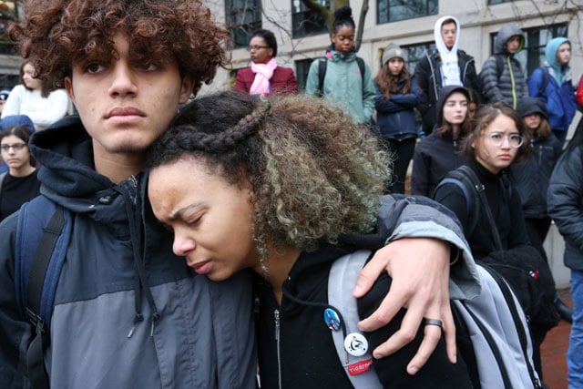 Junior Nigel Wallace comforts freshman Aleyana Pina during a student walkout to protest gun violence in schools and demand new gun control laws at Cambridge Rindge and Latin School in Cambridge, Massachusetts, on March 7, 2018. (Photo: Craig F. Walker / The Boston Globe via Getty Images)