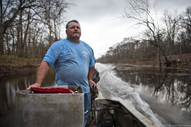 Jody Meche assesses the state of pipeline construction through the Atchafalaya Basin a day after a judge granted an injunction halting work. (Photo: Julie Dermansky)