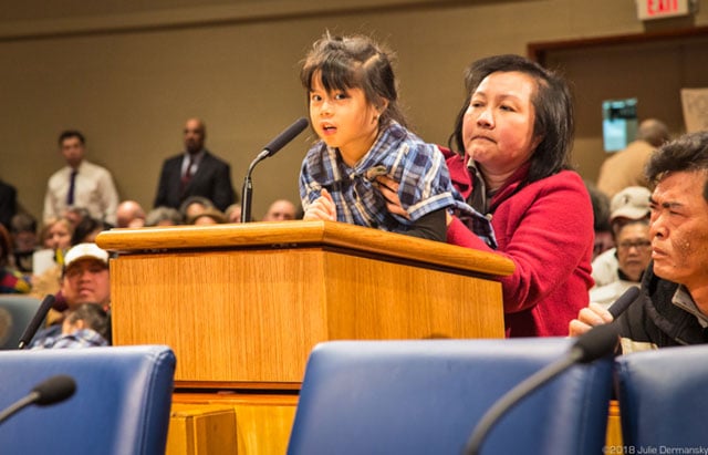 Christina Tran addresses the New Orleans City Council before the vote on Entergy’s gas plant.