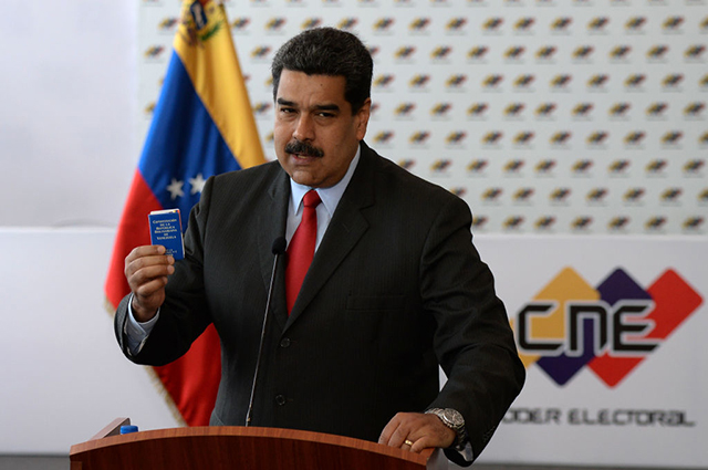 Venezuelan President Nicolas Maduro offers a press conference after the signing of the electoral guarantee agreement between the government and opposition presidential candidates, at the National Electoral Council (CNE) headquarters in Caracas on March 2, 2018. (Photo: Federico Parra / AFP / Getty Images)