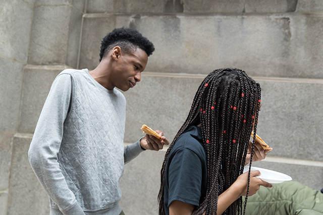 Students protesting at Chicago's City Hall take breaks to eat pizza from supporters outside the building after police refuse to allow food deliveries to the young protesters. (Photo: Sarah-Ji)