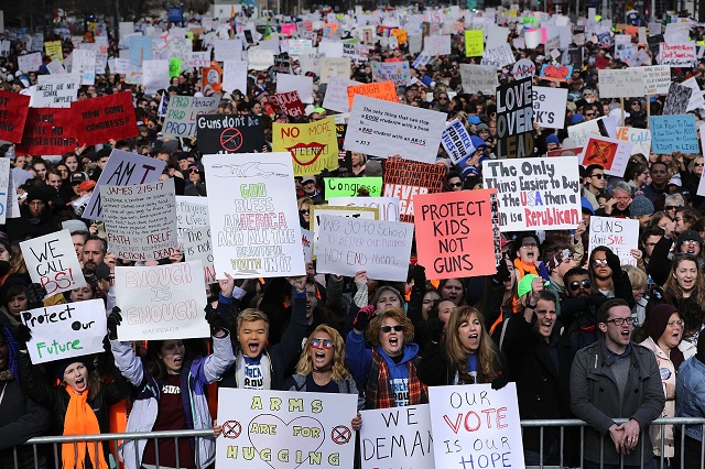 Protesters chant during the March for Our Lives rally along Pennsylvania Avenue March 24, 2018 in Washington, DC. Hundreds of thousands of demonstrators, including students, teachers and parents gathered in Washington for the anti-gun violence rally organized by survivors of the Marjory Stoneman Douglas High School school shooting on February 14 that left 17 dead. More than 800 related events are taking place around the world to call for legislative action to address school safety and gun violence. (Photo by Chip Somodevilla/Getty Images)