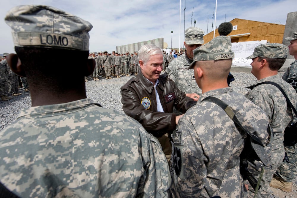 Secretary of Defense Robert M. Gates participates in a promotion ceremony during a visit with the Marine Corps' 1st Battalion, 17th Infantry Regiment March 9, 2010, at a forward operating base in Afghanistan.