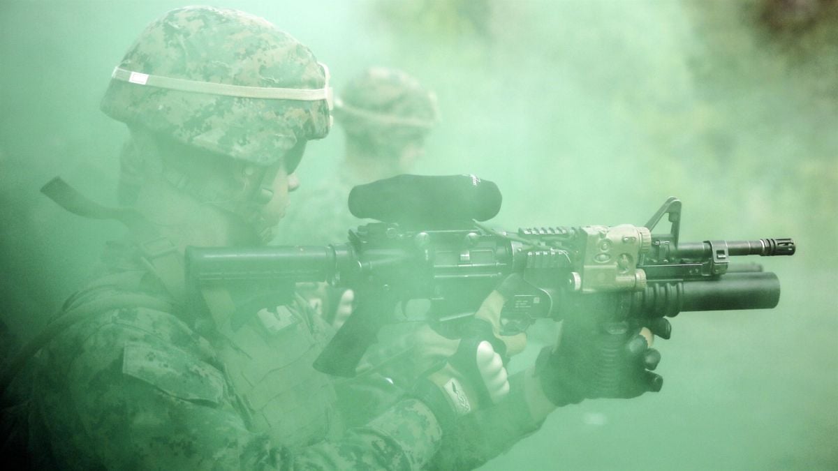 Marines navigate through a smoke bomb during nonlethal weapons training at Camp Lejeune, North Carolina, February 23, 2017.