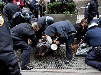 NYPD officers arrest two protestors with the Occupy Wall Street movement near Wall Street in Lower Manhattan in New York City, November 17, 2011.
