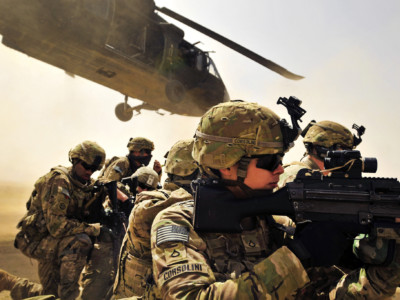 Pfc. Samuel Corsolini, 2nd Battalion, 25th Aviation Regiment, 25th Combat Aviation Brigade, pulls security with other Pathfinders as a UH-60 Black Hawk helicopter takes off after unloading his team and members of 2nd Afghan National Civil Order Patrol Special Weapons And Tactics Team in Kandahar province, Afghanistan, March 16.