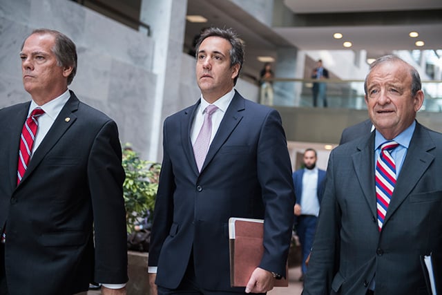 Michael Cohen, center, President Trump's personal attorney, leaves the Hart Building after his meeting with the Senate Intelligence Committee to discuss Russian election interference was postponed on September 19, 2017.